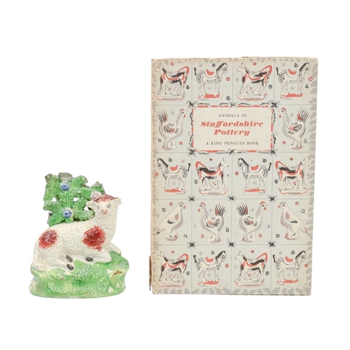 278 - Four Staffordshire pottery animal figures. Includes a Zebra, height 16cm, a swan family spill vase, ... 