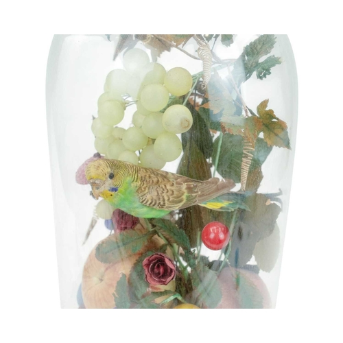 29 - A Victorian taxidermy, silk and wax display. Featuring a budgerigar on a basket of fruit and flowers... 