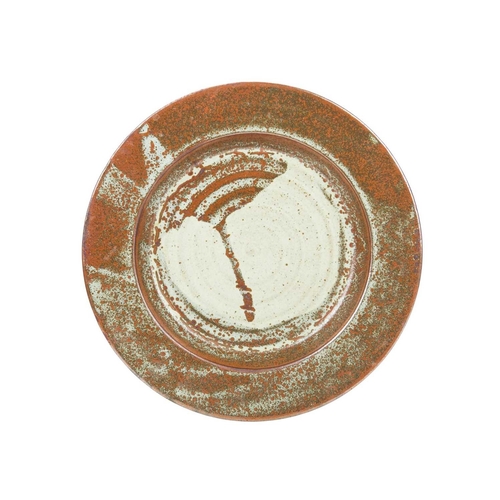 292 - A large studio pottery platter. Unmarked, diameter 40.5cm, together with a John Lomas iron glazed po... 