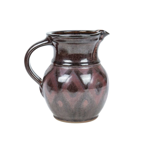 292 - A large studio pottery platter. Unmarked, diameter 40.5cm, together with a John Lomas iron glazed po... 