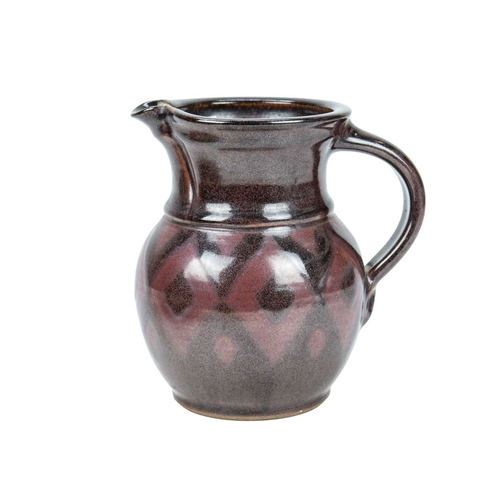 292 - A large studio pottery platter. Unmarked, diameter 40.5cm, together with a John Lomas iron glazed po... 