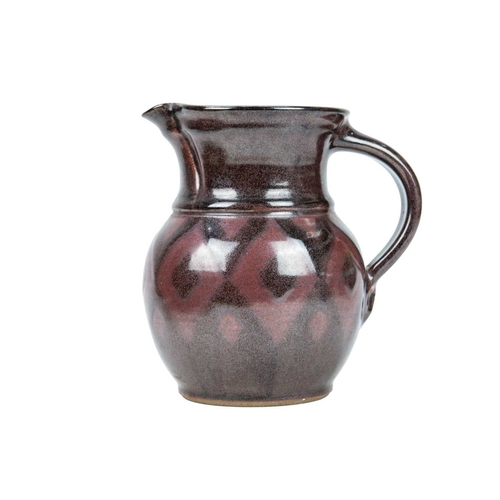 292 - A large studio pottery platter. Unmarked, diameter 40.5cm, together with a John Lomas iron glazed po... 