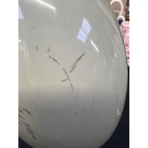 300 - A pair of porcelain moon flasks. Circa 1880, probably Minton, each with gilt handles and floral pain... 