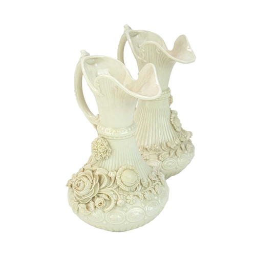 306 - A pair of Belleek 'Aberdeen' ewers. With floral encrusted decoration. Second period (1891-1926) fact... 