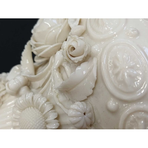 306 - A pair of Belleek 'Aberdeen' ewers. With floral encrusted decoration. Second period (1891-1926) fact... 