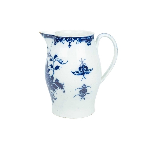 313 - A large pearlware jug. Circa 1800, painted in blue with floral and insect decoration, height 20cm.