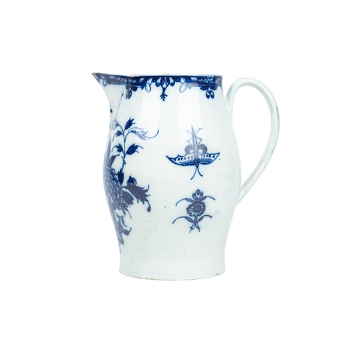 313 - A large pearlware jug. Circa 1800, painted in blue with floral and insect decoration, height 20cm.