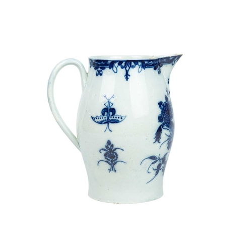 313 - A large pearlware jug. Circa 1800, painted in blue with floral and insect decoration, height 20cm.
