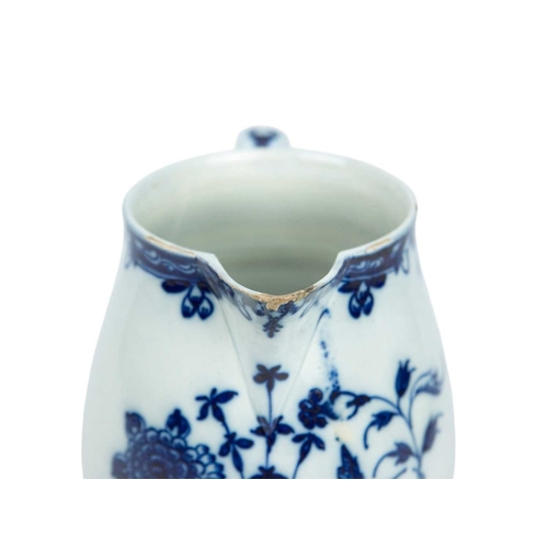 313 - A large pearlware jug. Circa 1800, painted in blue with floral and insect decoration, height 20cm.