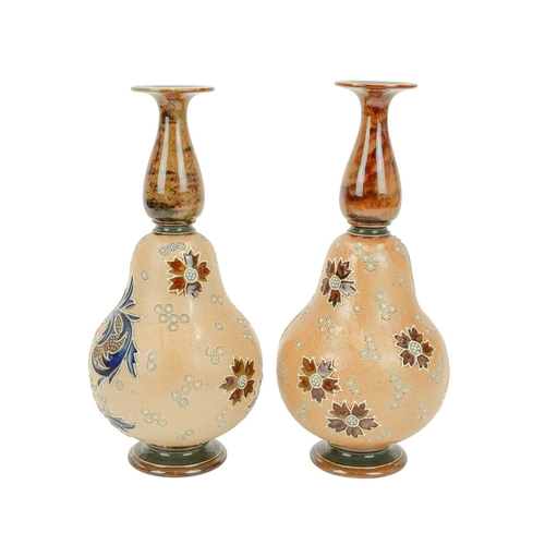 320 - A pair of Doulton Lambeth Slaters Patent vases. Of gourd shape, tube lined with stylised floral deco... 