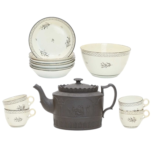 341 - A black basalt oval teapot and cover. Circa 1800, possibly Thomas Turner, moulded with a lion and ch... 