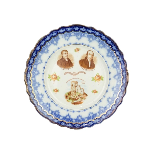 344 - A carved wood bread board. Diameter 30cm, with a W&T Avery marble effect pottery deli or butcher's p... 