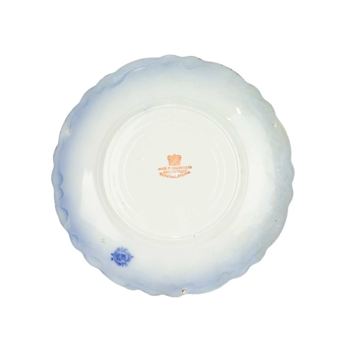 344 - A carved wood bread board. Diameter 30cm, with a W&T Avery marble effect pottery deli or butcher's p... 