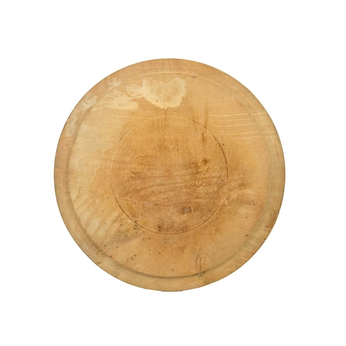 344 - A carved wood bread board. Diameter 30cm, with a W&T Avery marble effect pottery deli or butcher's p... 