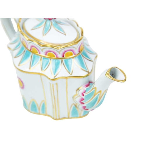 352 - A fine English pearlware teapot. Circa 1800, of elaborate moulded shape, enamelled with turquoise, f... 