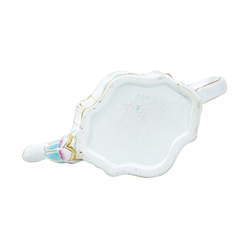 352 - A fine English pearlware teapot. Circa 1800, of elaborate moulded shape, enamelled with turquoise, f... 