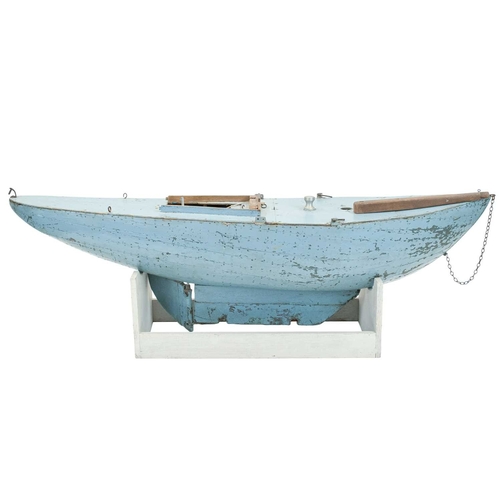 37 - An early 20th century pond yacht. With stand. Maximum height 31.5cm, width 94cm, depth 19cm.
