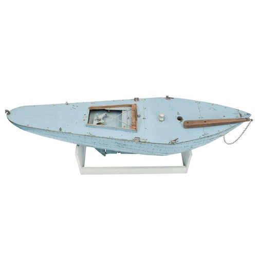 37 - An early 20th century pond yacht. With stand. Maximum height 31.5cm, width 94cm, depth 19cm.