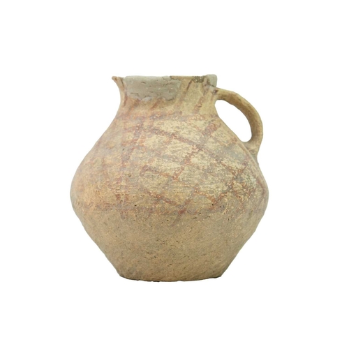 374 - A Chinese small pottery vessel. Neolithic, with a side handle and iron red cross-hatched painted dec... 