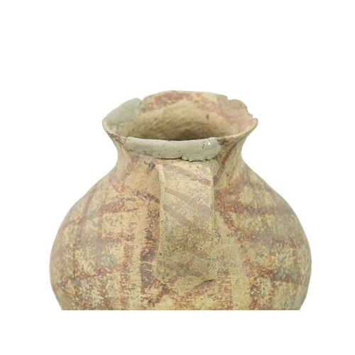 374 - A Chinese small pottery vessel. Neolithic, with a side handle and iron red cross-hatched painted dec... 