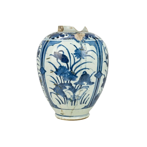 379 - A Japanese Arita vase. 17th century, ovoid form, with blue and white floral panel decoration, height... 