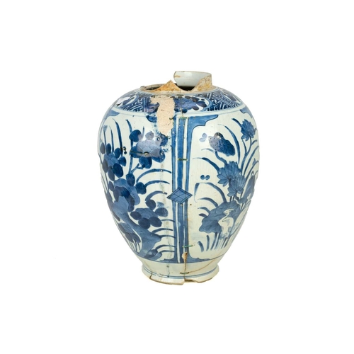 379 - A Japanese Arita vase. 17th century, ovoid form, with blue and white floral panel decoration, height... 