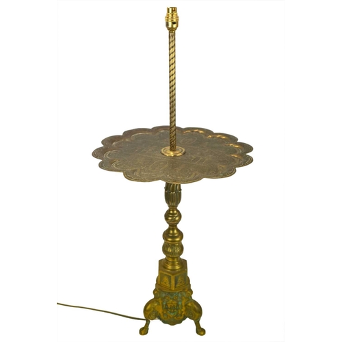 38 - A brass side table with integrated lamp. With an Indian engraved Benares tray table top with scallop... 