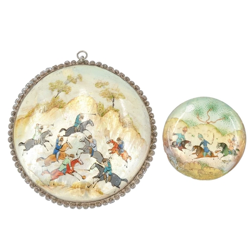 390 - A Persian mother of pearl disc pendant. Circa 1900, painted in coloured enamels with a polo scene, d... 