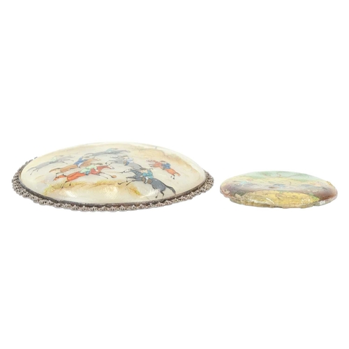 390 - A Persian mother of pearl disc pendant. Circa 1900, painted in coloured enamels with a polo scene, d... 