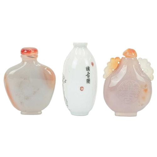 394 - Three Chinese snuff bottles. 19th/20th century, an ovoid porcelain example, painted with figures in ... 