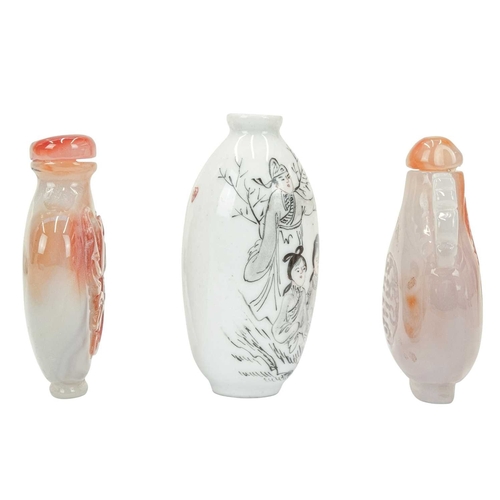 394 - Three Chinese snuff bottles. 19th/20th century, an ovoid porcelain example, painted with figures in ... 