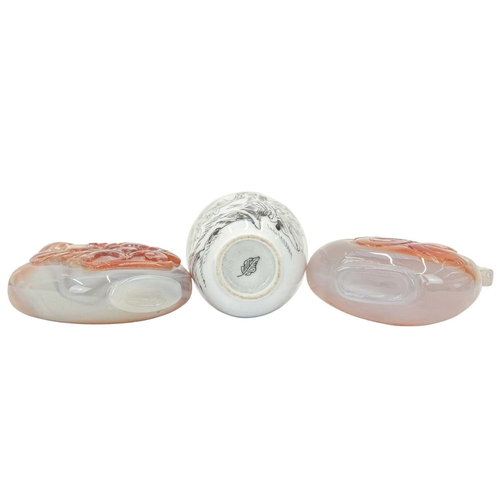 394 - Three Chinese snuff bottles. 19th/20th century, an ovoid porcelain example, painted with figures in ... 