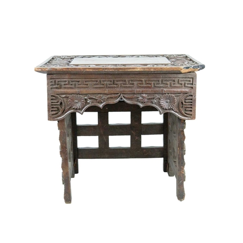 395 - A Chinese hardwood folding table. Circa 1900, the top and frieze carved with dragons on folding supp... 