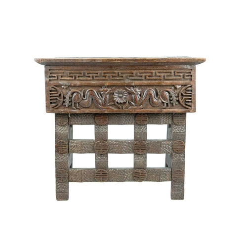 395 - A Chinese hardwood folding table. Circa 1900, the top and frieze carved with dragons on folding supp... 