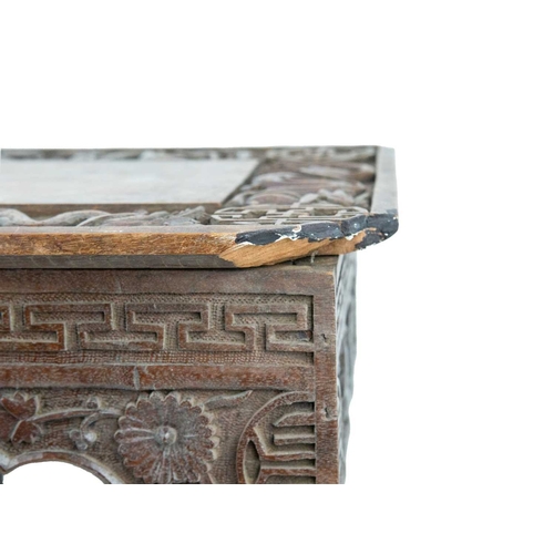 395 - A Chinese hardwood folding table. Circa 1900, the top and frieze carved with dragons on folding supp... 