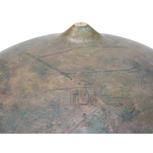 415 - A large Chinese bronze tripod censer, ding. Qing dynasty, with twin handles, cast in relief and chas... 