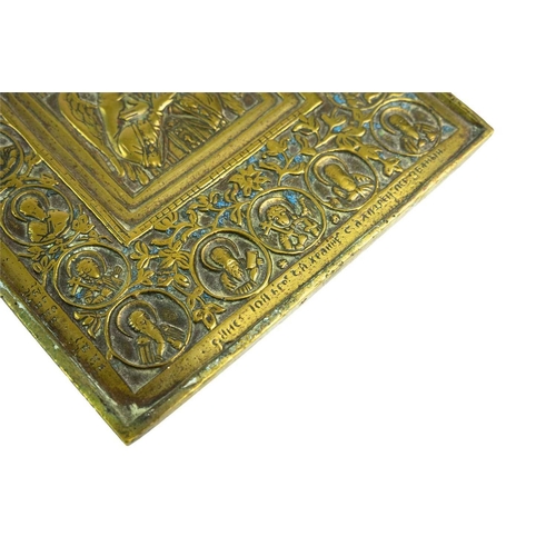 42 - A 19th century Russian Orthodox brass icon. Cast in relief with a central image of Jesus depicted as... 