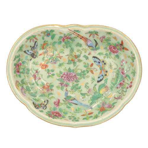432 - A Chinese Canton porcelain dish. Late 19th century, of kidney shape, painted in a famille rose palet... 