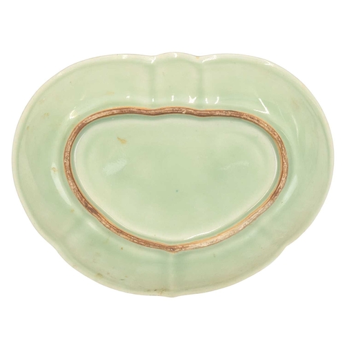 432 - A Chinese Canton porcelain dish. Late 19th century, of kidney shape, painted in a famille rose palet... 