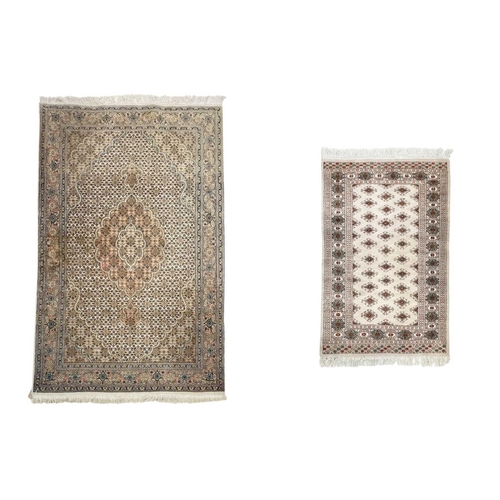 468 - A wool pile Tabriz rug. In muted tones, central scalloped medallion within floral borders, 166cm x 1... 