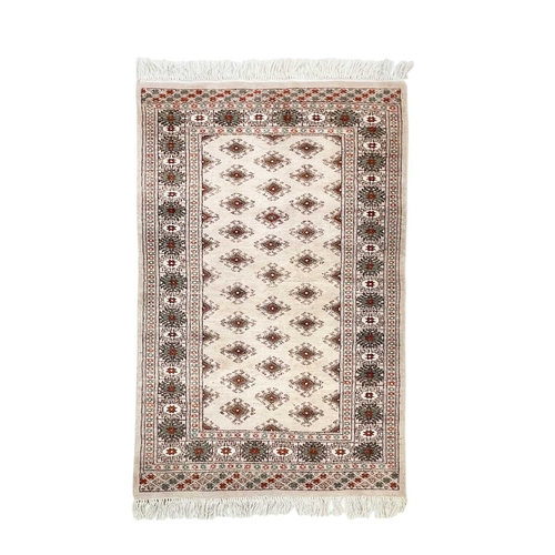 468 - A wool pile Tabriz rug. In muted tones, central scalloped medallion within floral borders, 166cm x 1... 