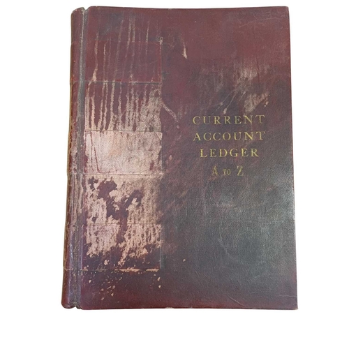 47 - A large late 19th/early 20th century maroon leather bound 'Current Account Ledger'. Together with an... 