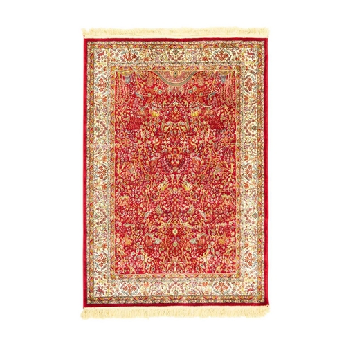 482 - A cashmere 'Tree of Life' rug. Modern, red ground, the central panel depicting giraffes and other an... 
