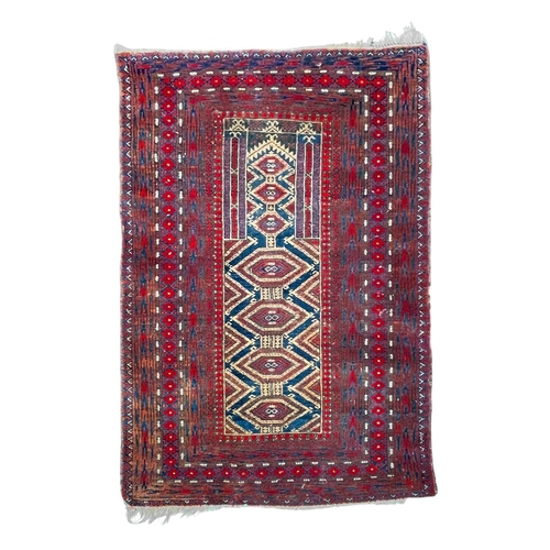 491 - An Afghan wool prayer rug. Red ground, geometric central panel within multiple borders, 142cm x 96cm... 