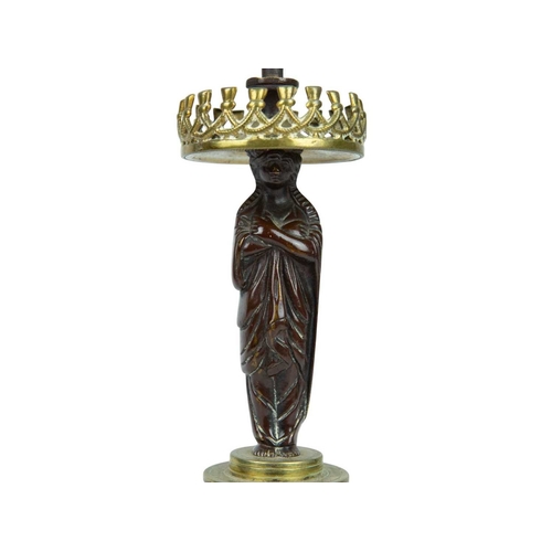 52 - A bronze and ormolu figural candelabrum. 19th century, twin branches with a draped female figure sta... 