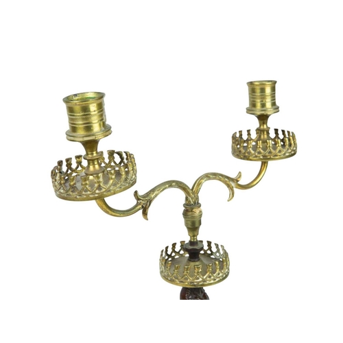 52 - A bronze and ormolu figural candelabrum. 19th century, twin branches with a draped female figure sta... 