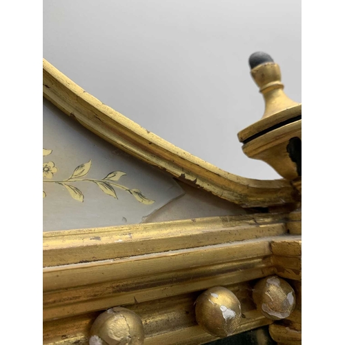 522 - A pair of giltwood and verre eglomise mirrors or pier glasses. Circa 1900, the swept tops with paint... 