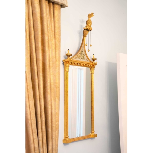 522 - A pair of giltwood and verre eglomise mirrors or pier glasses. Circa 1900, the swept tops with paint... 