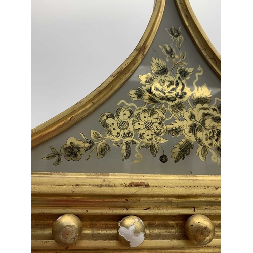 522 - A pair of giltwood and verre eglomise mirrors or pier glasses. Circa 1900, the swept tops with paint... 