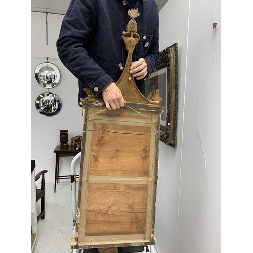 522 - A pair of giltwood and verre eglomise mirrors or pier glasses. Circa 1900, the swept tops with paint... 